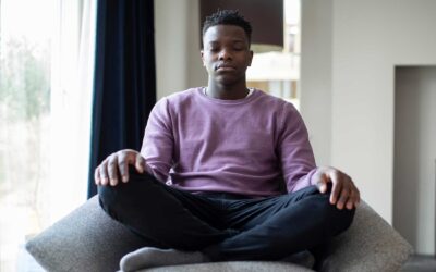 Person meditating in lotus position